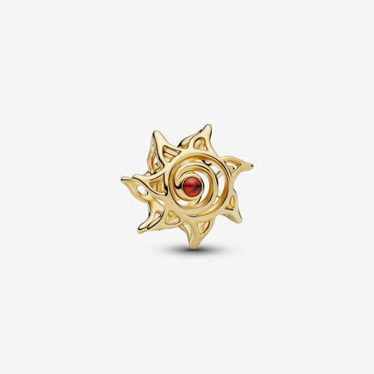 Genuine Pandora 14kt gold blend openwork charm featuring a bursting sun motif and a central dark-orange imitation crystal.