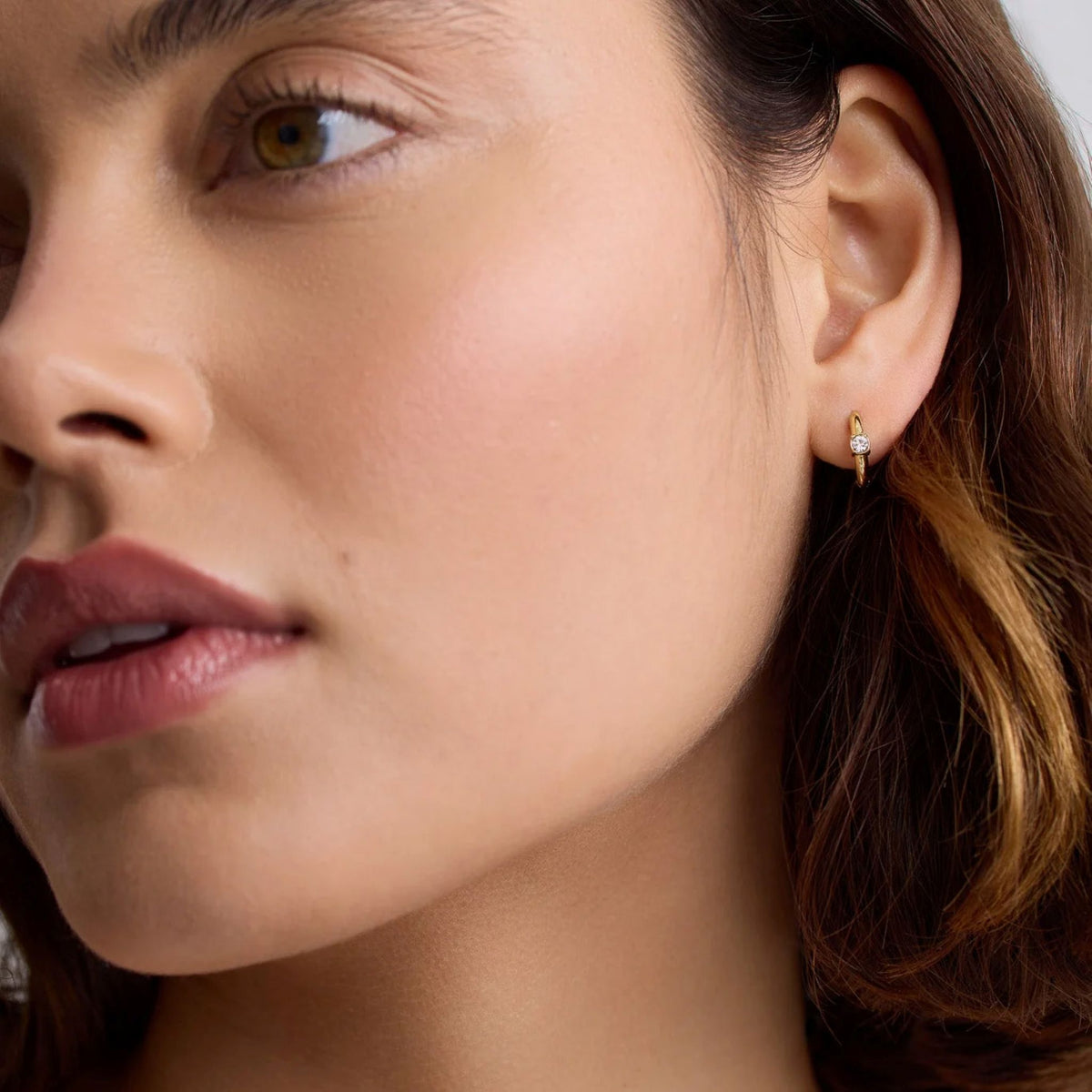 D.LOUISE Gold Crystal Solitaire Huggie Earrings