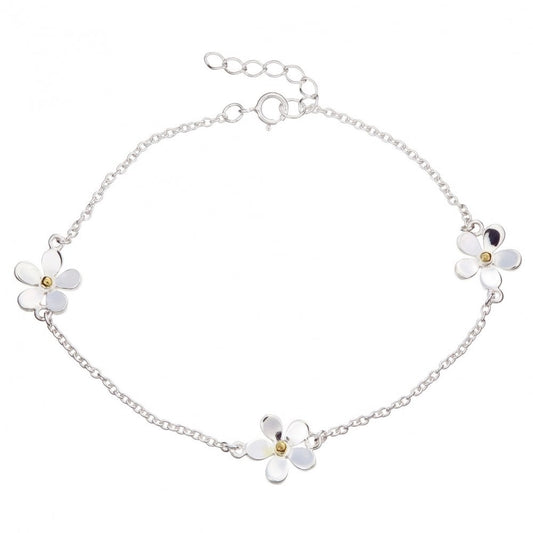 A fine sterling silver chain bracelet featuring three evenly spaced daisy flowers with 18kt gold centres, complete with a spring ring clasp and adjustable extender.
