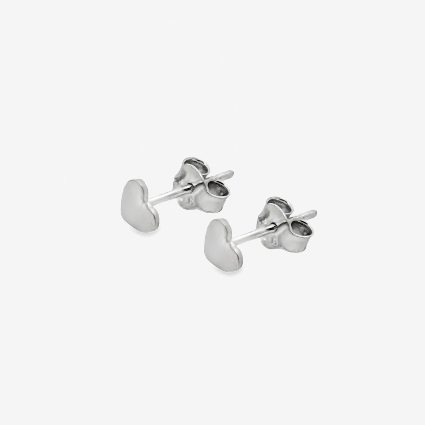 A pair of small 6mm sterling silver heart-shaped stud earrings with a highly polished finish and standard butterfly backs.