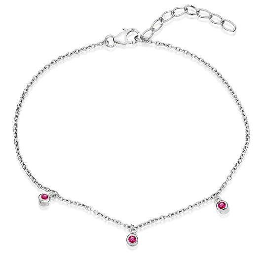 A slender sterling silver trace chain bracelet featuring three evenly spaced bright pink cubic zirconia stones and an adjustable extender.